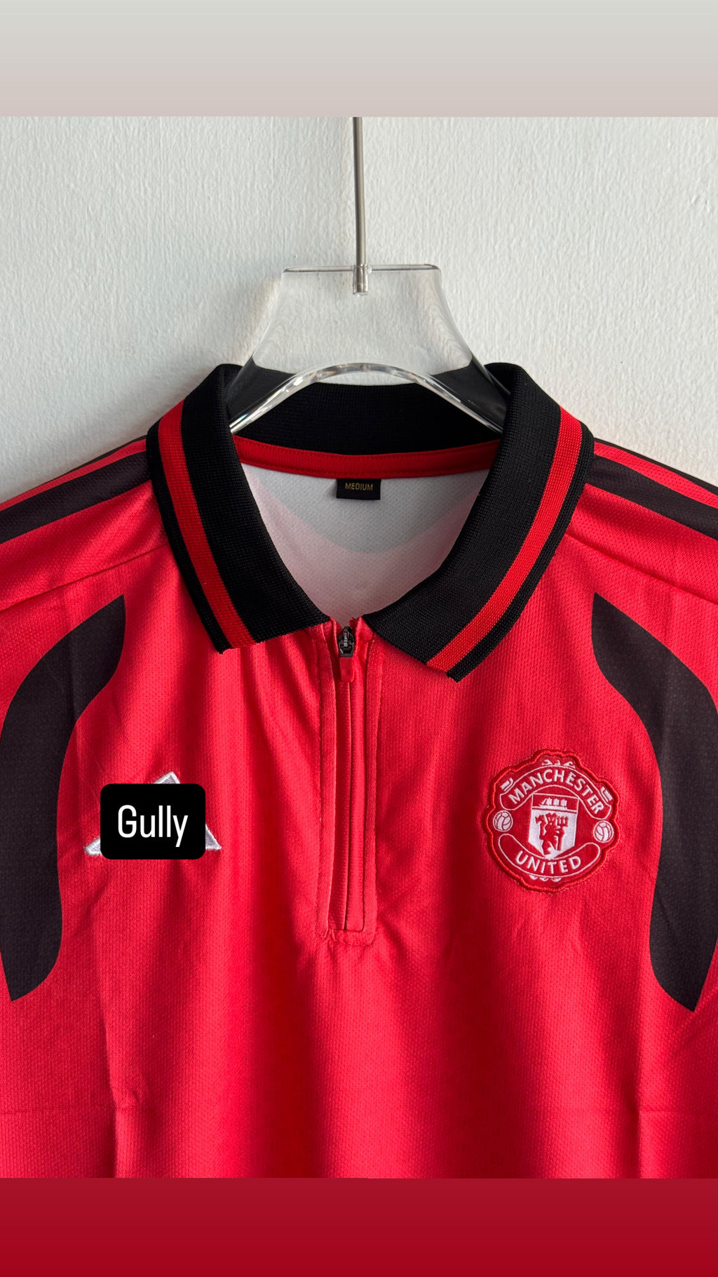UNITED TRIO KIT 26/27 POLO ZIP EMBROIDERY