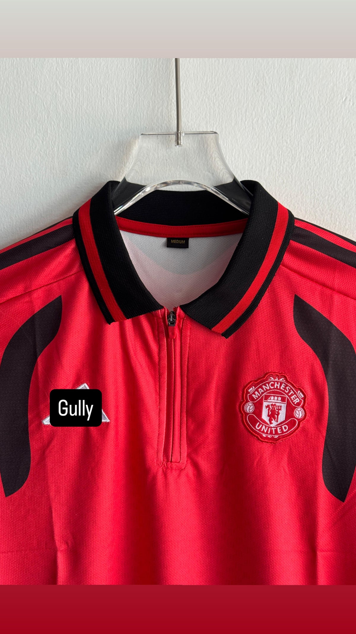 UNITED TRIO KIT 26/27 POLO ZIP EMBROIDERY